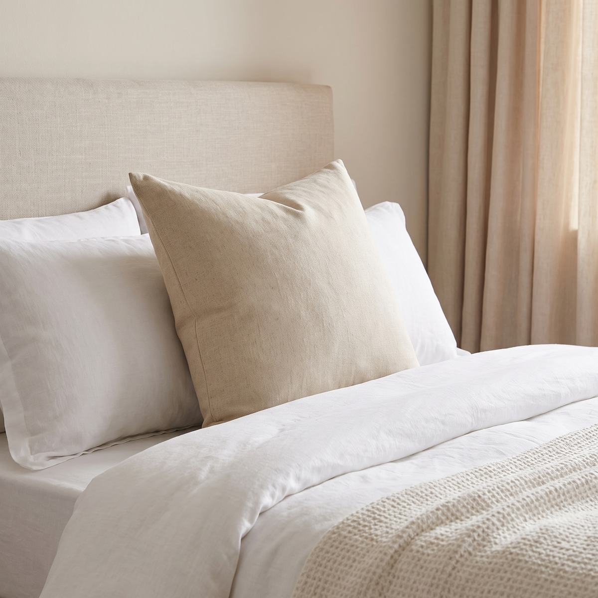 Australian Made Polyester Fibre Cushion Insert – inside a cover on a bed