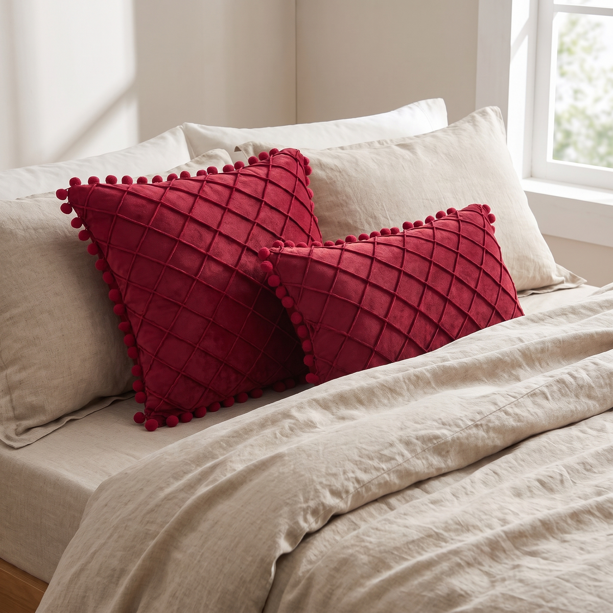 Quilted Luxe Cushion Cover with Pom Pom Trim – styled on a bed