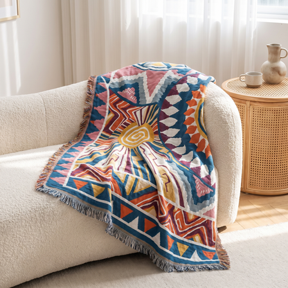 Nordic Sunburst Cotton Throw Blanket – draped over a sofa
