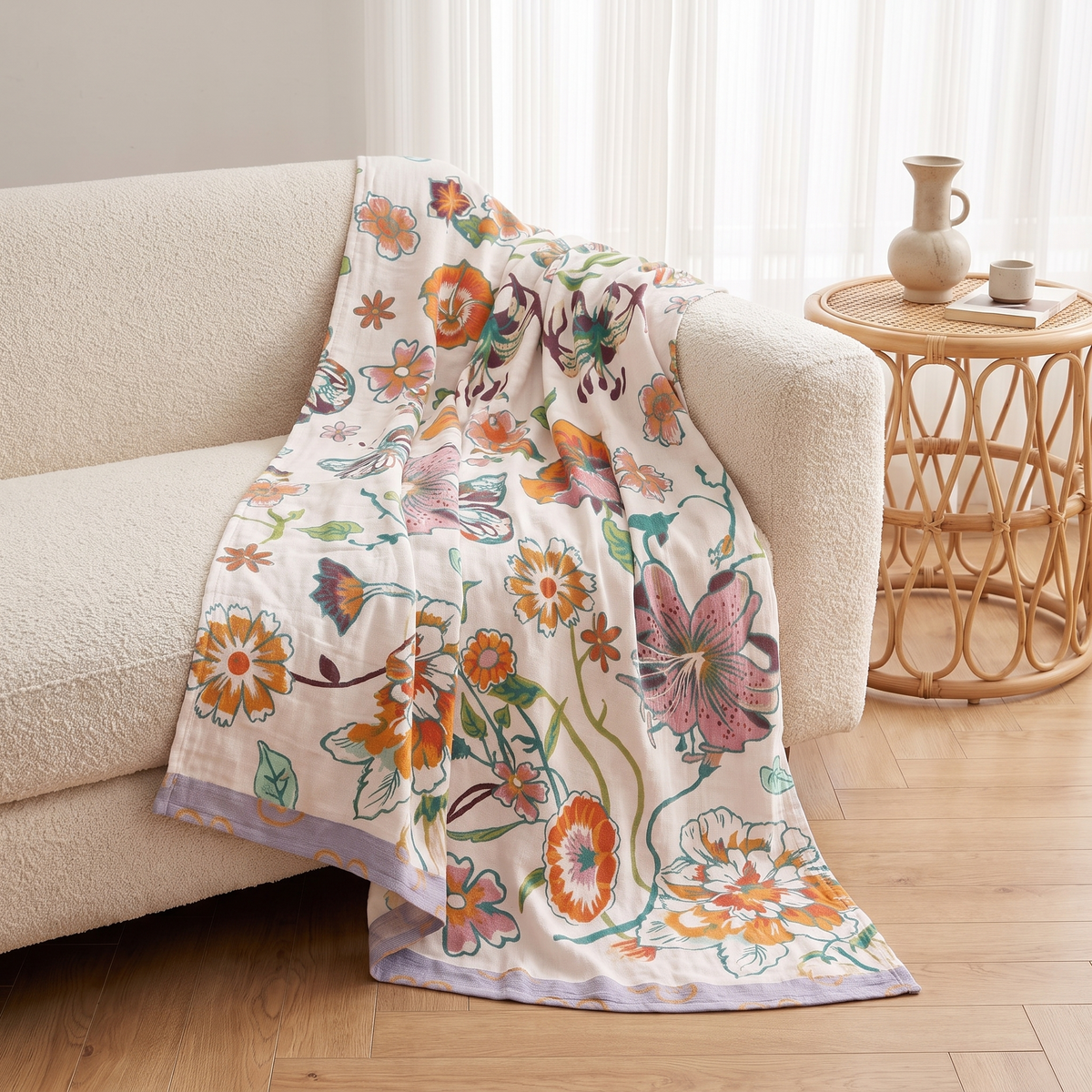 Wildflower Botanical Cotton Throw Blanket – draped over a sofa