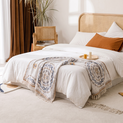 Serene Mandala Cotton Throw Blanket – folded on a bed