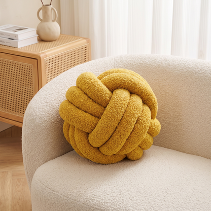 Knotted Boucle Cushion – styled on a sofa