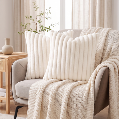 Striped Faux Fur Cushion Cover – Cream – styled on an armchair