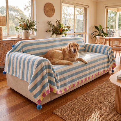 Pastel Striped Couch Cover – Atelier – with a dog on the sofa