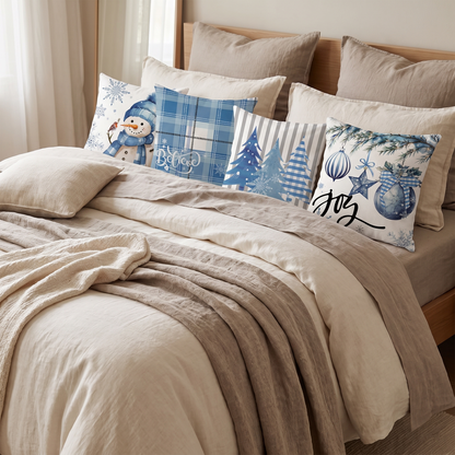 Blue Snowman Christmas Cushion Covers – Set of 4 – styled on a bed