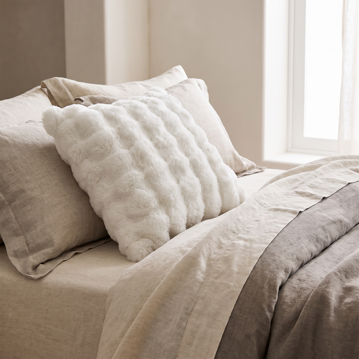 Faux Fur Cushion Cover – Rabbit Soft – styled on a bed